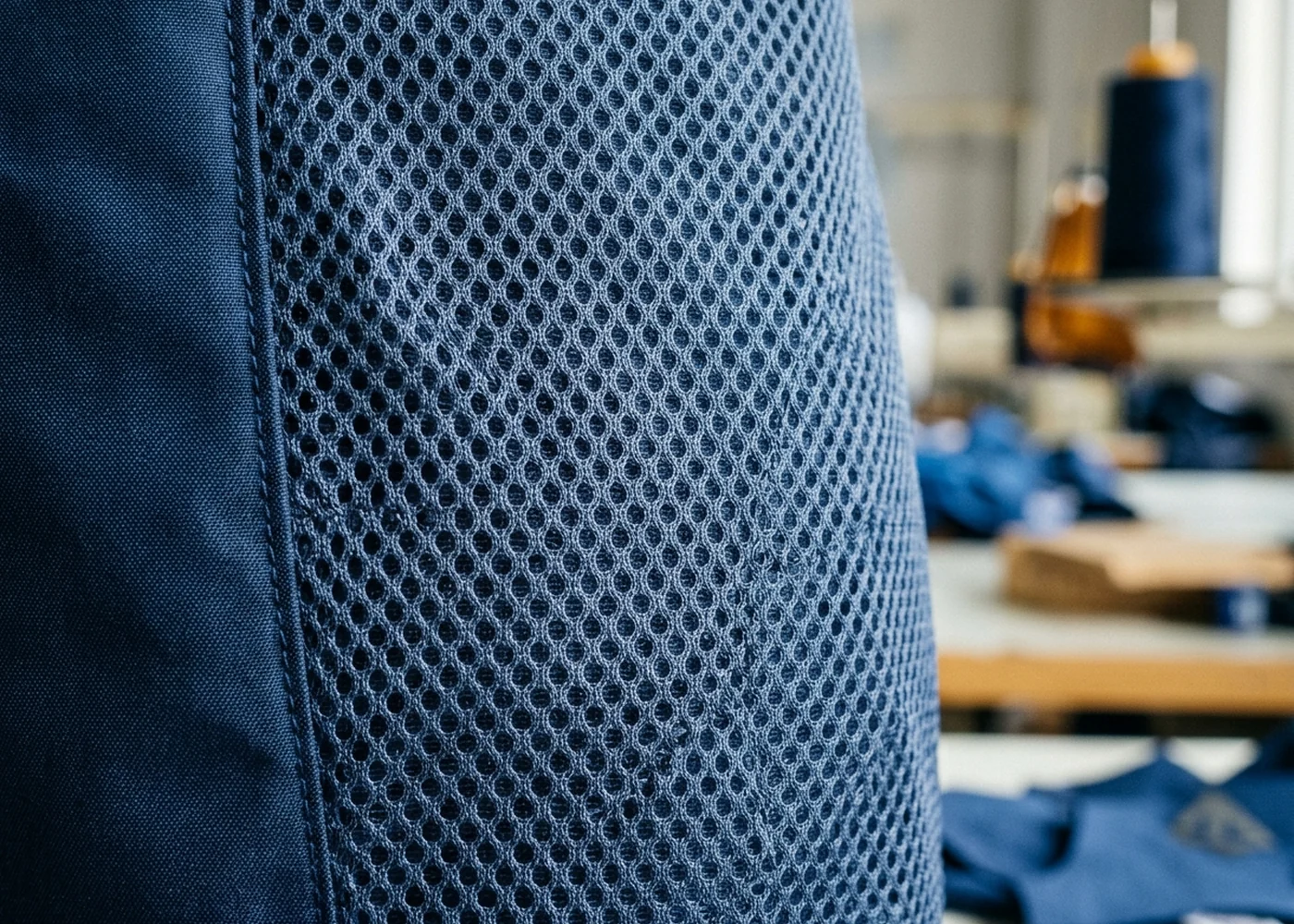 Macro of open mesh polyester fabric used for vented side inserts on a hockey pant shell